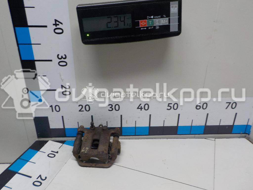 Фото Суппорт тормозной задний левый  44011JG00A для Nissan X-Trail {forloop.counter}}