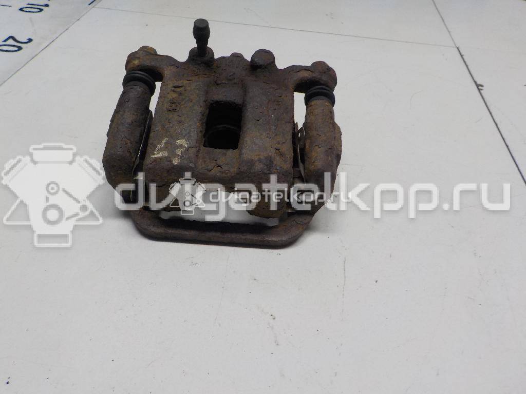 Фото Суппорт тормозной задний левый  44011JG00A для Nissan X-Trail {forloop.counter}}