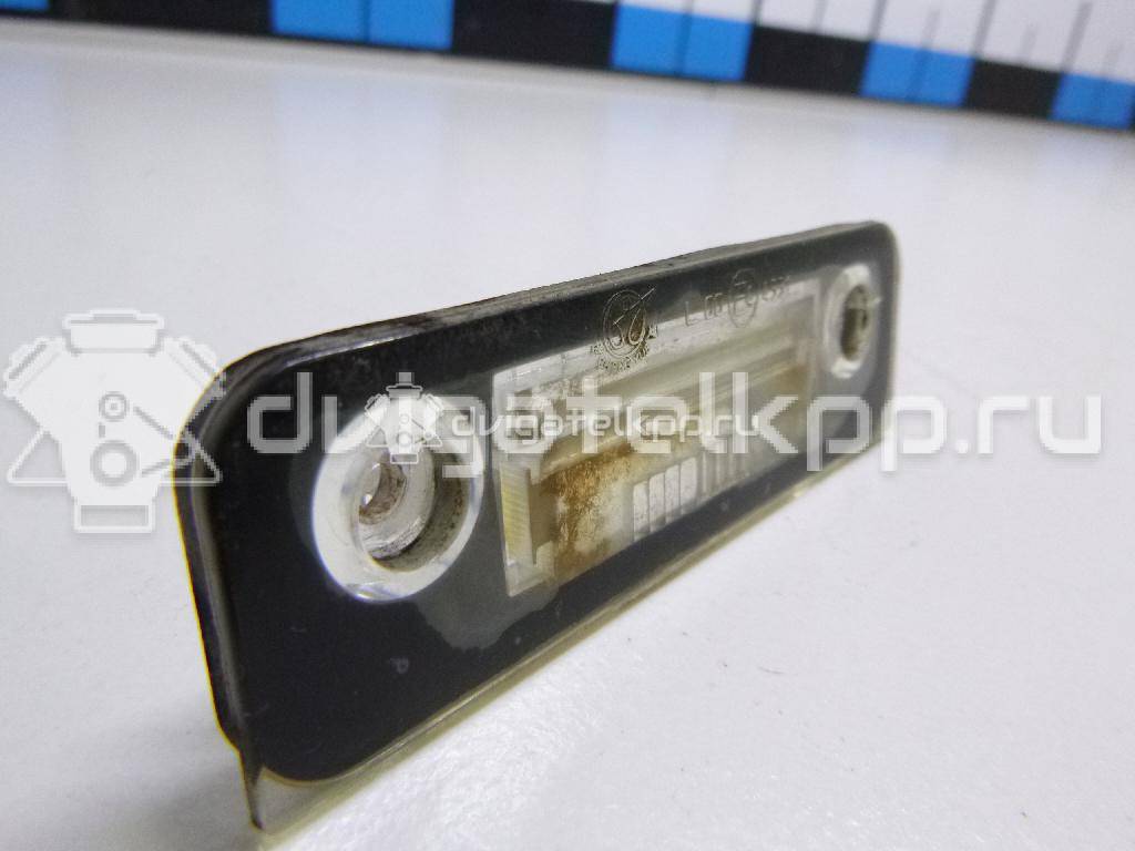Фото Фонарь подсветки номера  1332916 для Ford Fiesta / Mondeo / Fusion Ju {forloop.counter}}