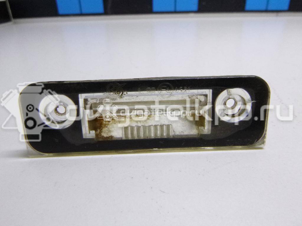 Фото Фонарь подсветки номера  1332916 для Ford Fiesta / Mondeo / Fusion Ju {forloop.counter}}