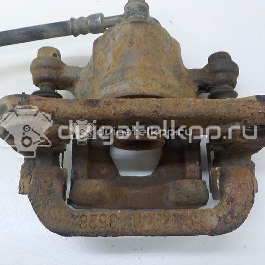 Фото Суппорт тормозной задний правый  440011KD0A для Nissan Tiida / Qashqai / Cube Z12 / Juke F15 / Pulsar C13