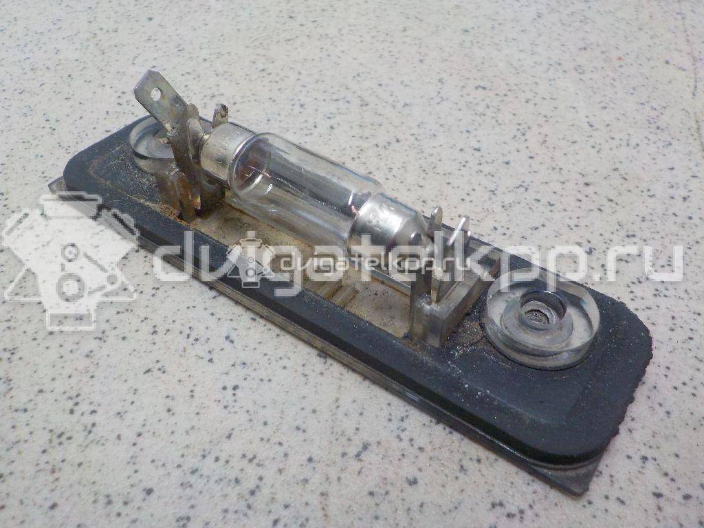 Фото Фонарь подсветки номера  1332916 для Ford Fiesta / Mondeo / Fusion Ju {forloop.counter}}