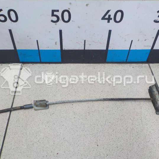 Фото Трос стояночного тормоза центральный  1205735 для Ford Fiesta / Puma Ec / Ka / Fusion Ju