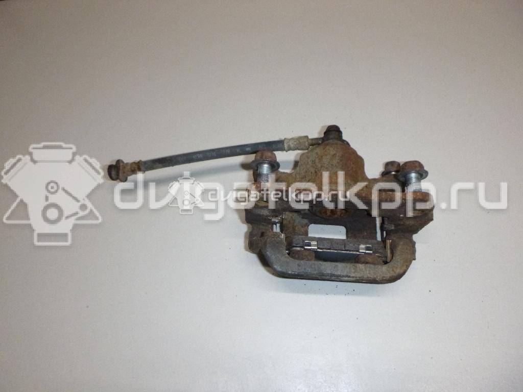 Фото Суппорт тормозной задний правый  440011KD0A для Nissan Tiida / Qashqai / Cube Z12 / Juke F15 / Pulsar C13 {forloop.counter}}