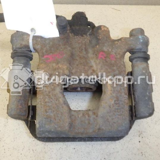 Фото Суппорт тормозной задний левый  440111KD0A для Nissan Tiida / Qashqai / Cube Z12 / Juke F15 / Pulsar C13