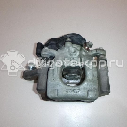 Фото Суппорт тормозной задний левый  440114EA0A для Nissan Qashqai
