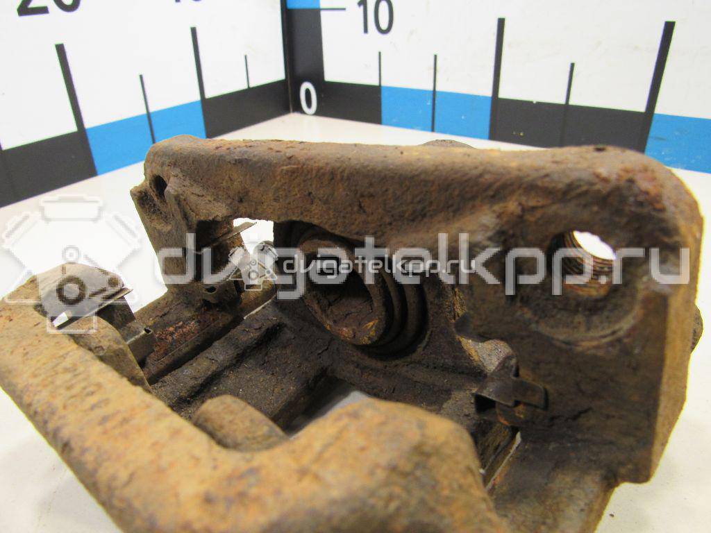 Фото Суппорт тормозной задний левый  44011JG00A для Nissan X-Trail {forloop.counter}}