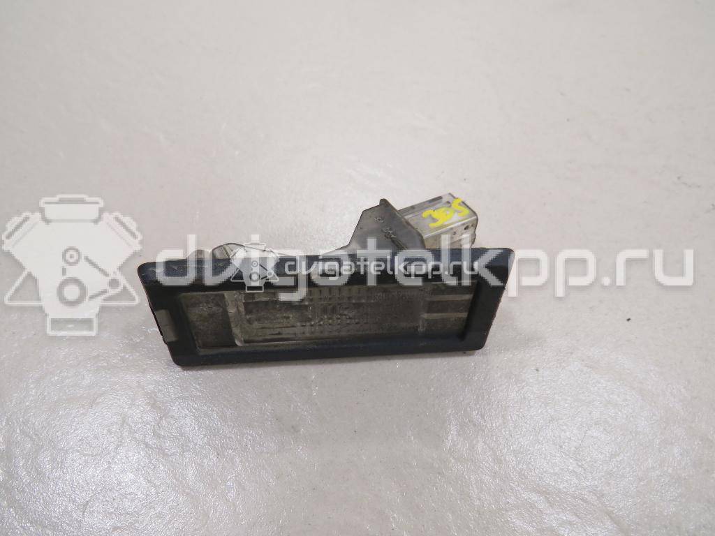 Фото Фонарь подсветки номера  8200013577 для Renault Modus Grand F Jp0 / Megane / Clio / Laguna / Scénic {forloop.counter}}