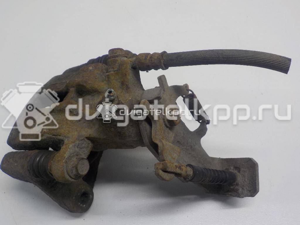 Фото Суппорт тормозной задний правый  44001BM40A для Nissan Primera / Almera {forloop.counter}}