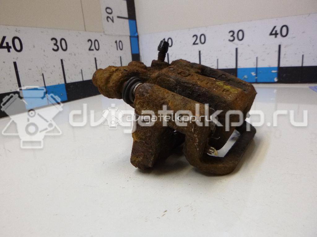 Фото Суппорт тормозной задний правый  440011KD0A для Nissan Tiida / Qashqai / Cube Z12 / Juke F15 / Pulsar C13 {forloop.counter}}