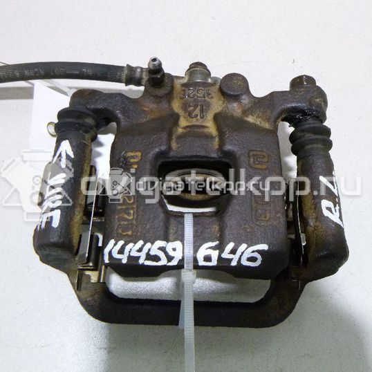 Фото Суппорт тормозной задний левый  440111KD0A для Nissan Tiida / Qashqai / Cube Z12 / Juke F15 / Pulsar C13