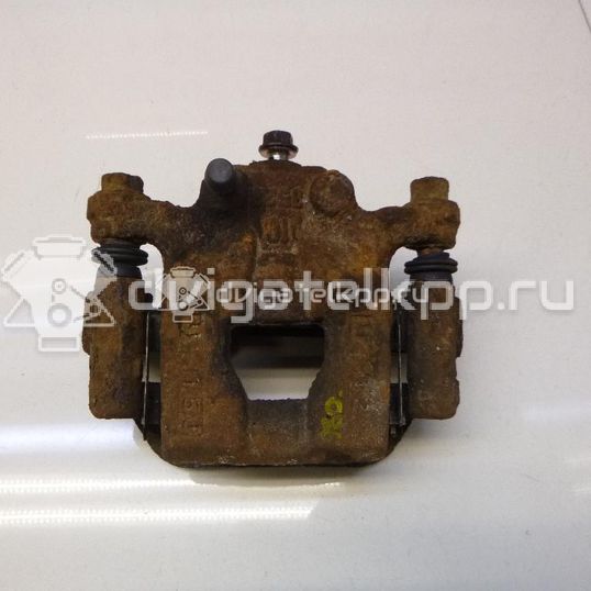 Фото Суппорт тормозной задний левый  440111KD0A для Nissan Tiida / Qashqai / Cube Z12 / Juke F15 / Pulsar C13