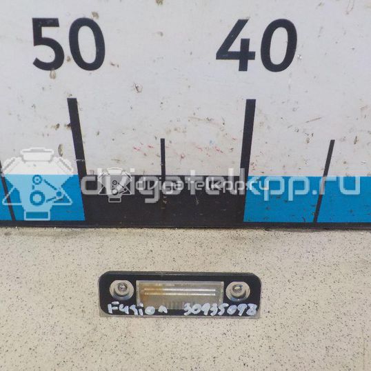 Фото Фонарь подсветки номера  1332916 для Ford Fiesta / Mondeo / Fusion Ju