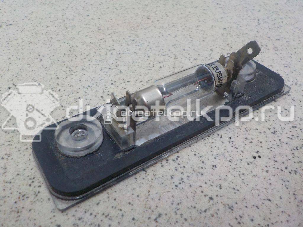 Фото Фонарь подсветки номера  1332916 для Ford Fiesta / Mondeo / Fusion Ju {forloop.counter}}