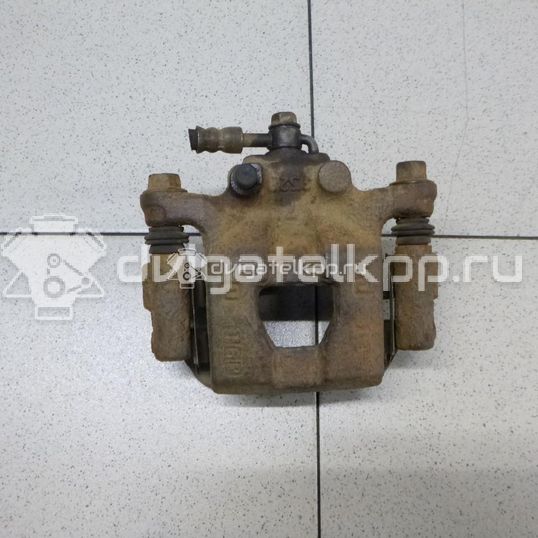 Фото Суппорт тормозной задний левый  440111KD0A для Nissan Tiida / Qashqai / Cube Z12 / Juke F15 / Pulsar C13