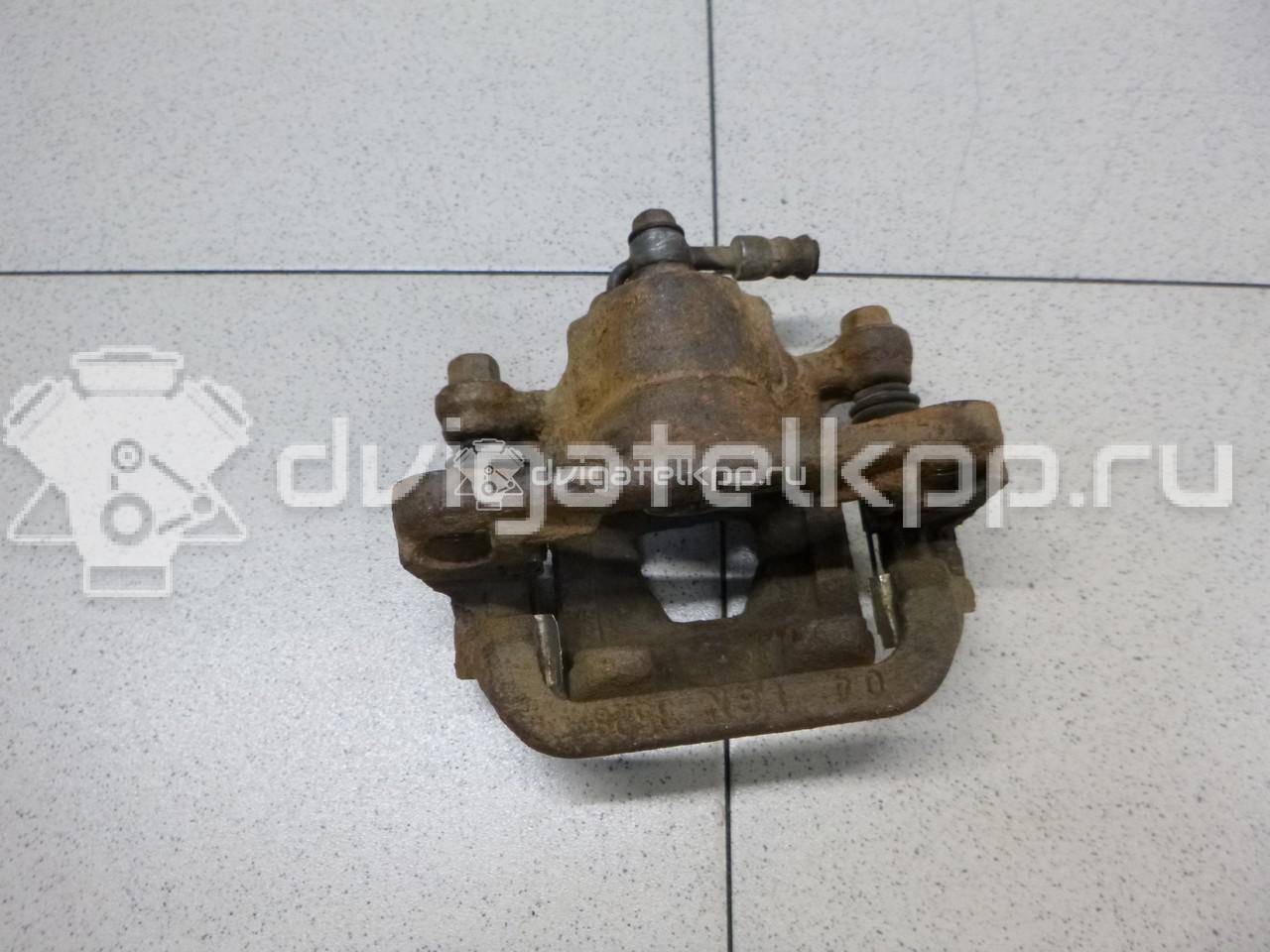 Фото Суппорт тормозной задний левый  440111KD0A для Nissan Tiida / Qashqai / Cube Z12 / Juke F15 / Pulsar C13 {forloop.counter}}