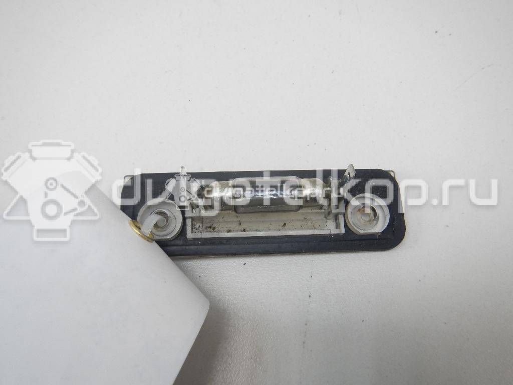 Фото Фонарь подсветки номера  1332916 для Ford Fiesta / Mondeo / Fusion Ju {forloop.counter}}
