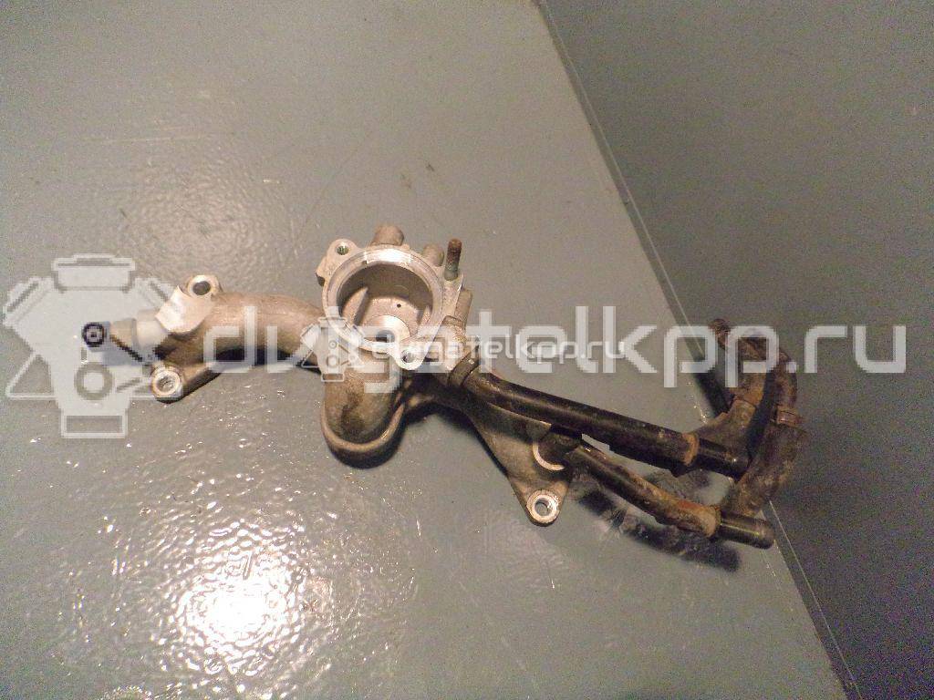 Фото Корпус термостата для двигателя G6EA для Hyundai / Kia 170-194 л.с 24V 2.7 л бензин 256203E200 {forloop.counter}}