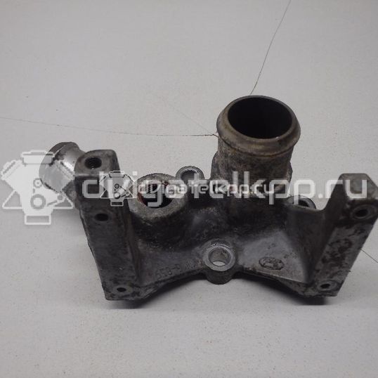 Фото Фланец двигателя системы охлаждения  1221325 для Ford Fiesta / Focus / Puma Ec
