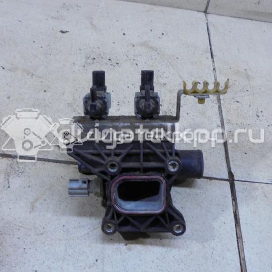 Фото Фланец двигателя системы охлаждения  6G9G8K556AA для Ford Fiesta / Focus / Tourneo / C-Max / Galaxy