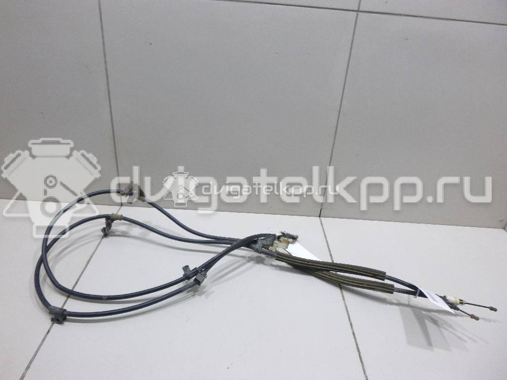 Фото Трос стояночного тормоза  2074151 для Ford Focus / C-Max {forloop.counter}}