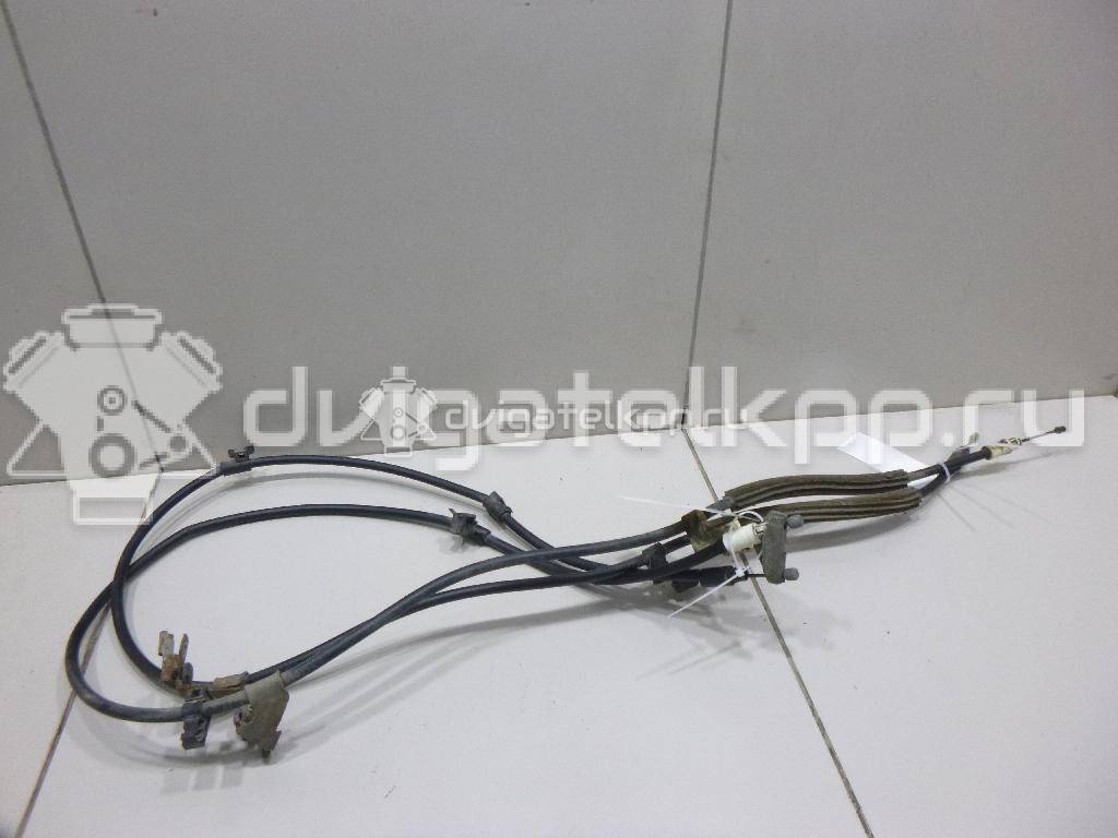 Фото Трос стояночного тормоза  2074151 для Ford Focus / C-Max {forloop.counter}}