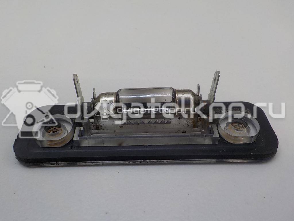 Фото Фонарь подсветки номера  1332916 для Ford Fiesta / Mondeo / Fusion Ju {forloop.counter}}