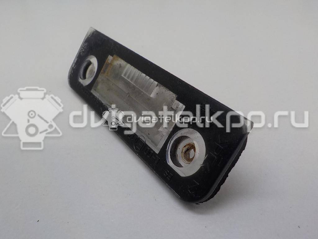 Фото Фонарь подсветки номера  1332916 для Ford Fiesta / Mondeo / Fusion Ju {forloop.counter}}