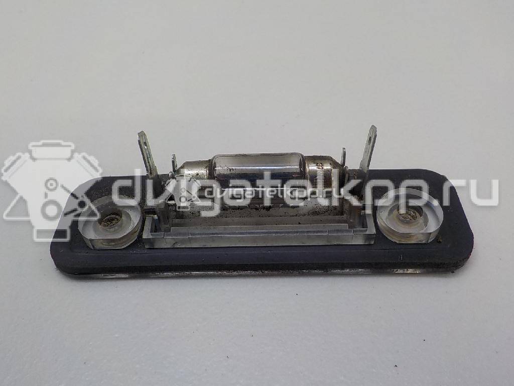 Фото Фонарь подсветки номера  1332916 для Ford Fiesta / Mondeo / Fusion Ju {forloop.counter}}