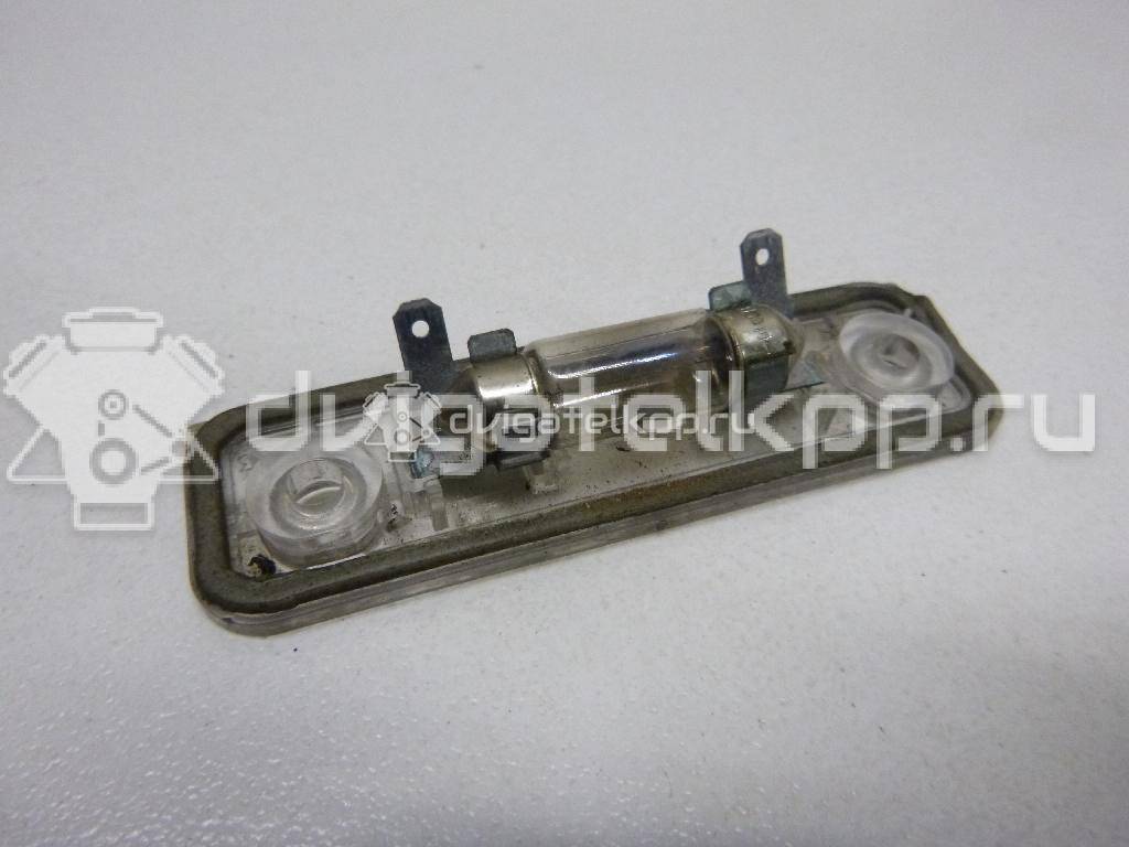 Фото Фонарь подсветки номера  1332916 для Ford Fiesta / Mondeo / Fusion Ju {forloop.counter}}