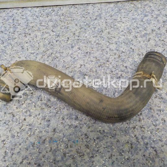 Фото Патрубок радиатора  1546445 для Ford Fiesta / Fusion Ju