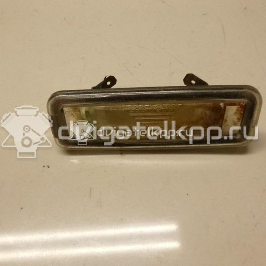 Фото Фонарь подсветки номера  1109489 для Ford Focus