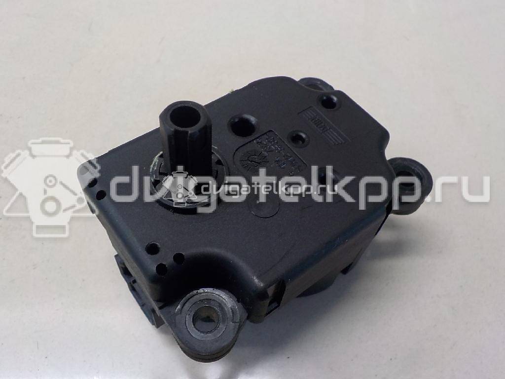 Фото Моторчик заслонки отопителя  1S7H19E616AA для Ford Focus / Mondeo {forloop.counter}}