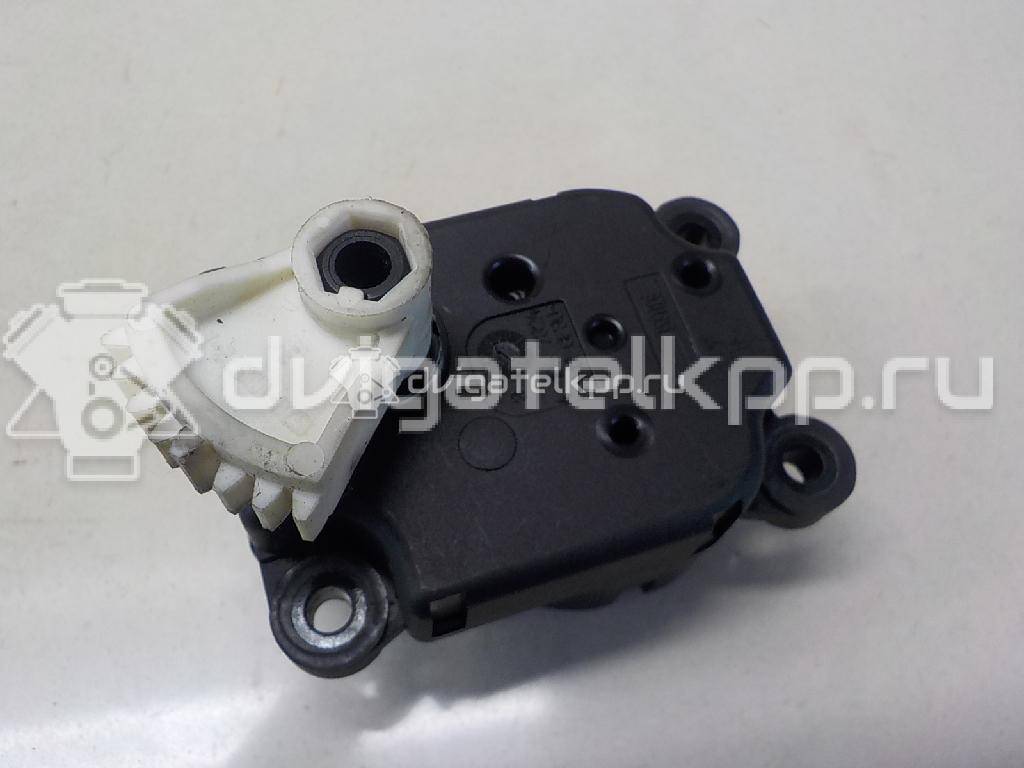 Фото Моторчик заслонки отопителя  1S7H19E616AA для Ford Focus / Mondeo {forloop.counter}}