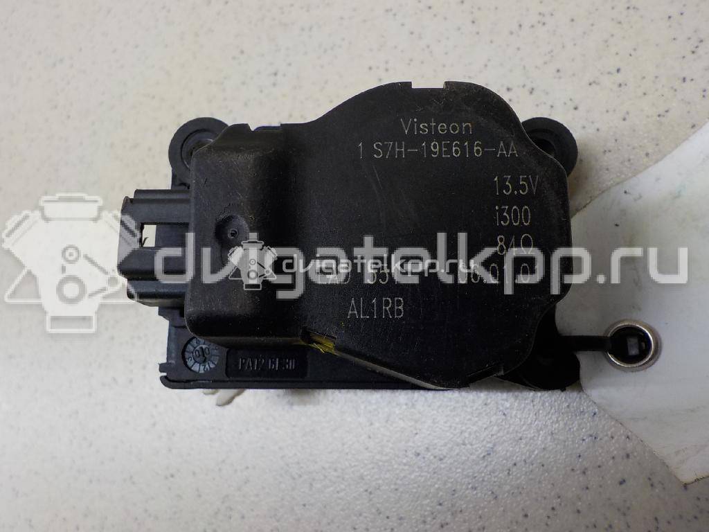 Фото Моторчик заслонки отопителя  1S7H19E616AA для Ford Focus / Mondeo {forloop.counter}}