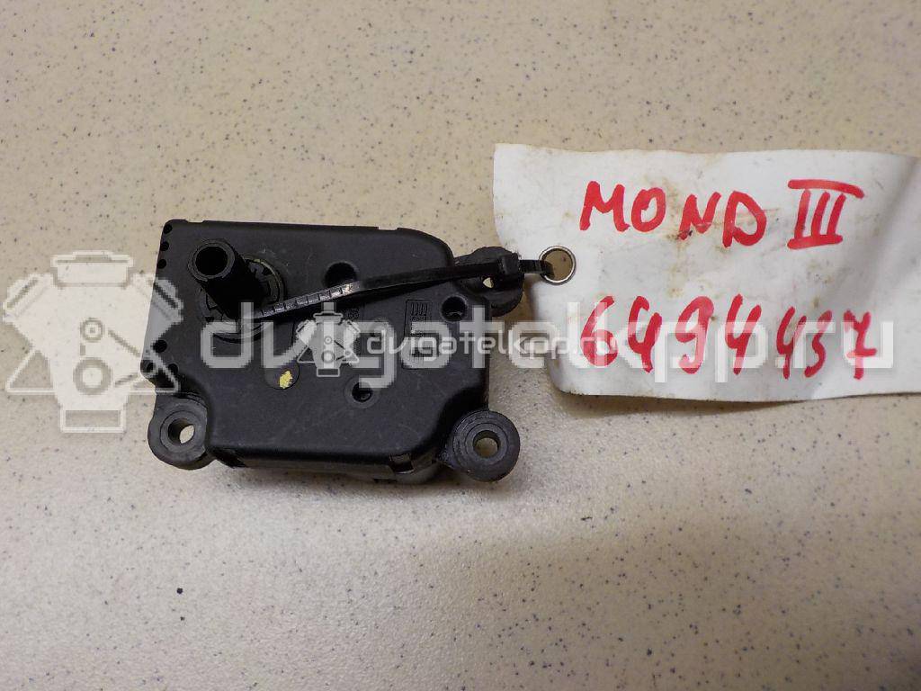 Фото Моторчик заслонки отопителя  1S7H19E616AA для Ford Focus / Mondeo {forloop.counter}}