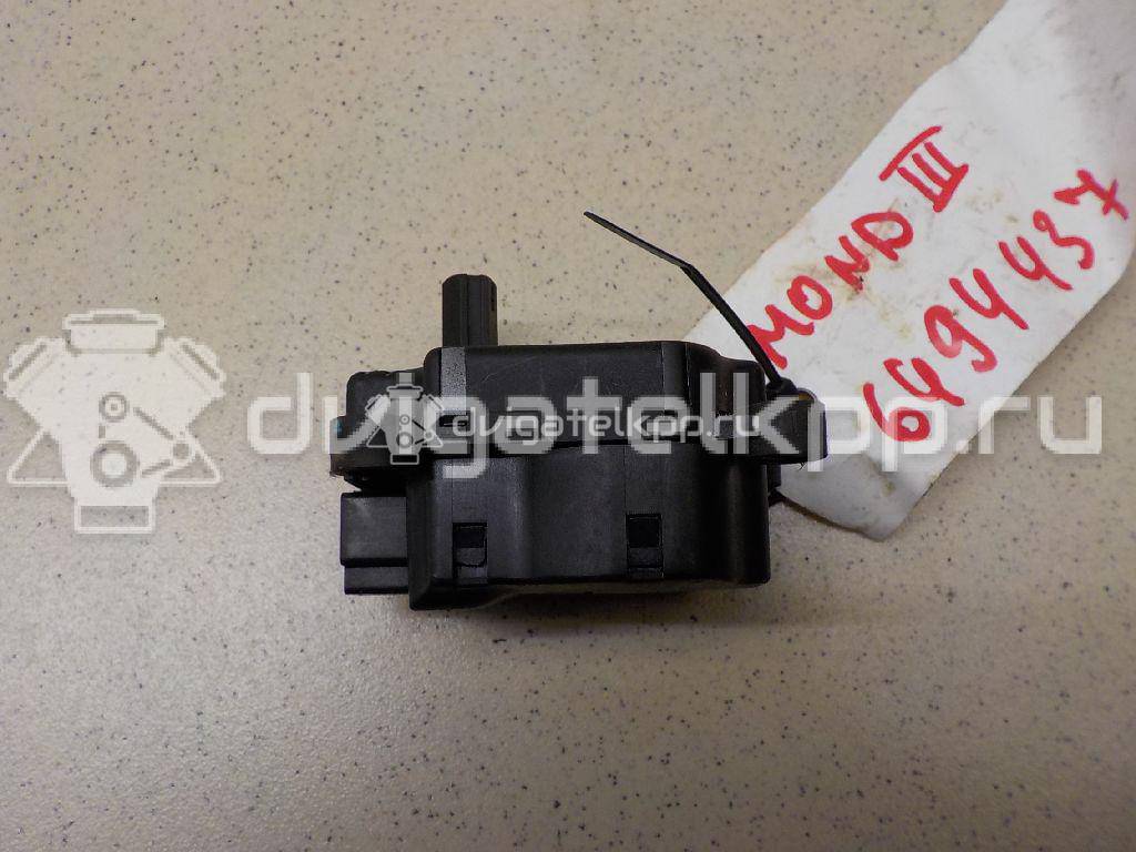 Фото Моторчик заслонки отопителя  1S7H19E616AA для Ford Focus / Mondeo {forloop.counter}}
