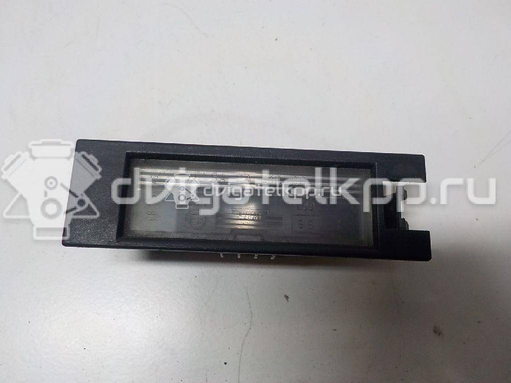 Фото Фонарь подсветки номера  09164143 для opel Corsa C {forloop.counter}}