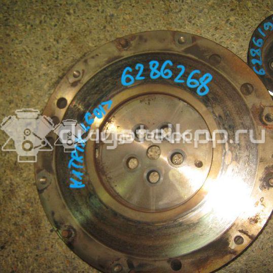 Фото Маховик для двигателя G4EE для Kia Rio / Pride 97 л.с 16V 1.4 л бензин 2320026101