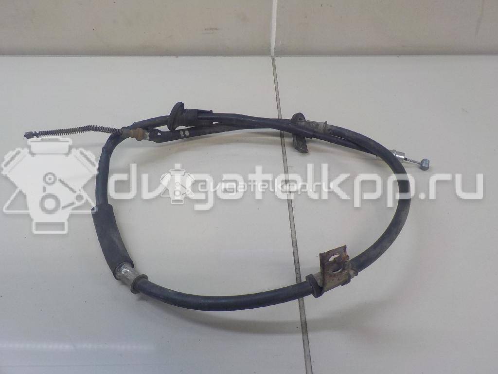 Фото Трос стояночного тормоза левый  5976025000 для Hyundai Accent / S Coupe Slc / Pony {forloop.counter}}