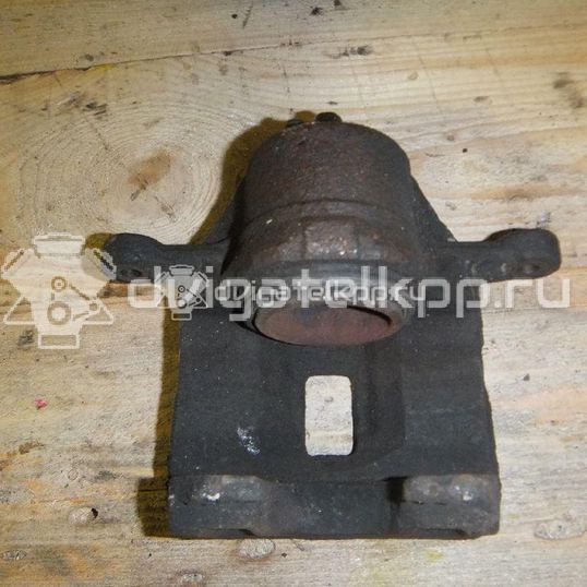 Фото Суппорт тормозной передний левый  581802DA10 для Hyundai Matrix Fc / Elantra / Coupe / Lantra / Atos Mx