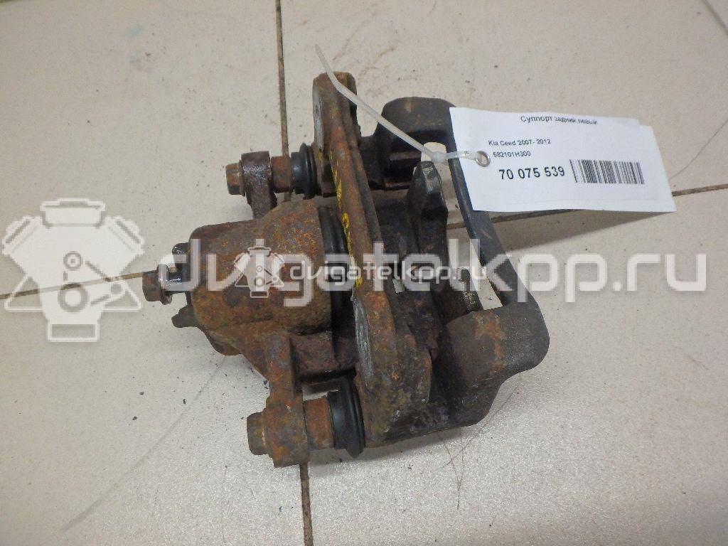 Фото Суппорт тормозной задний левый  582101H300 для Hyundai I30 {forloop.counter}}