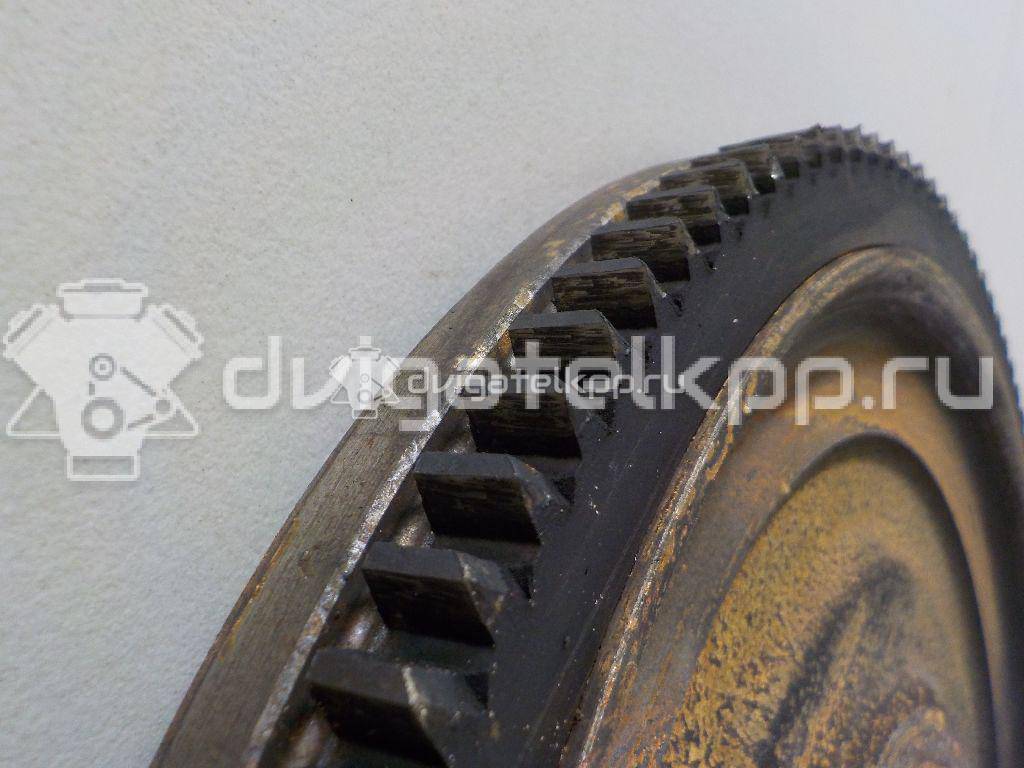 Фото Маховик для двигателя QG16DE для Nissan Sunny / Bluebird / Avenir / Primera / Almera 102-120 л.с 16V 1.6 л бензин 123119F600 {forloop.counter}}