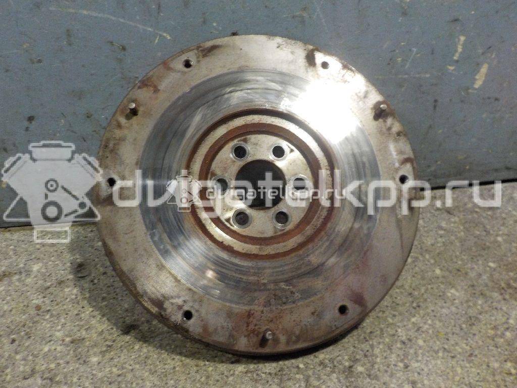 Фото Маховик для двигателя QG16DE для Nissan Sunny / Bluebird / Avenir / Primera / Almera 102-120 л.с 16V 1.6 л бензин 123119F600 {forloop.counter}}