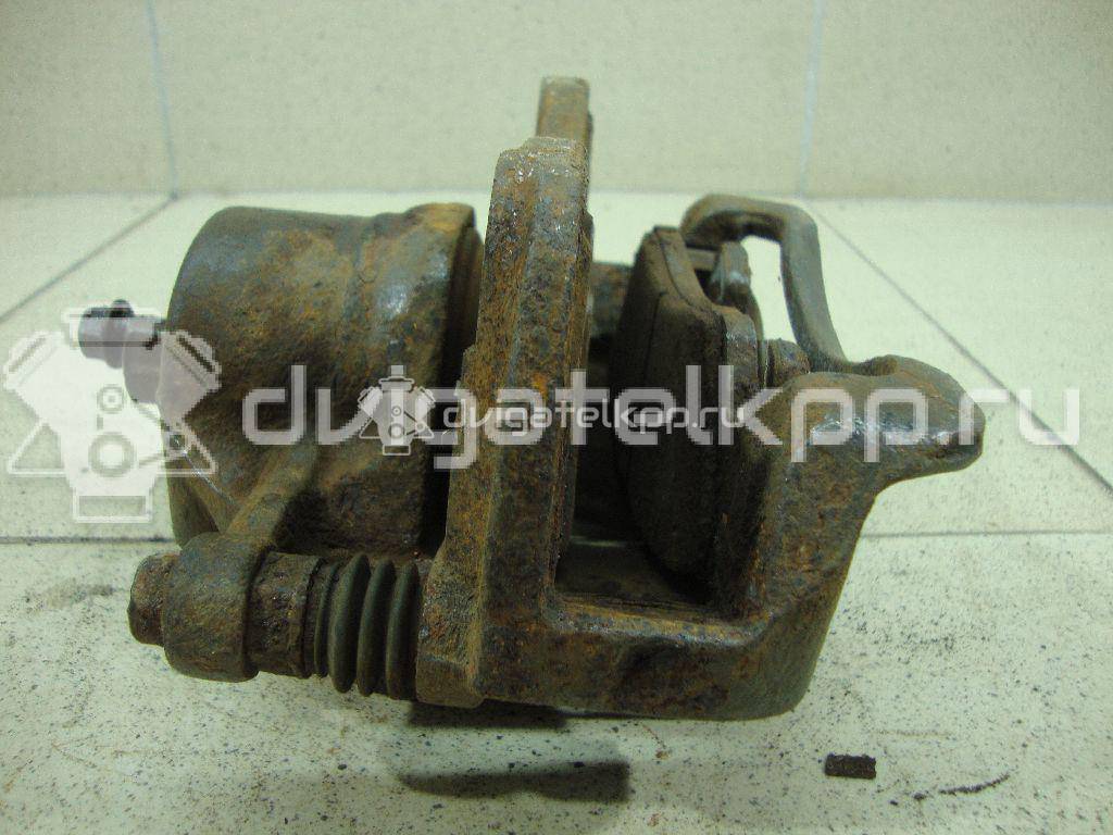 Фото Суппорт тормозной передний правый  581901RA00 для Hyundai I20 {forloop.counter}}