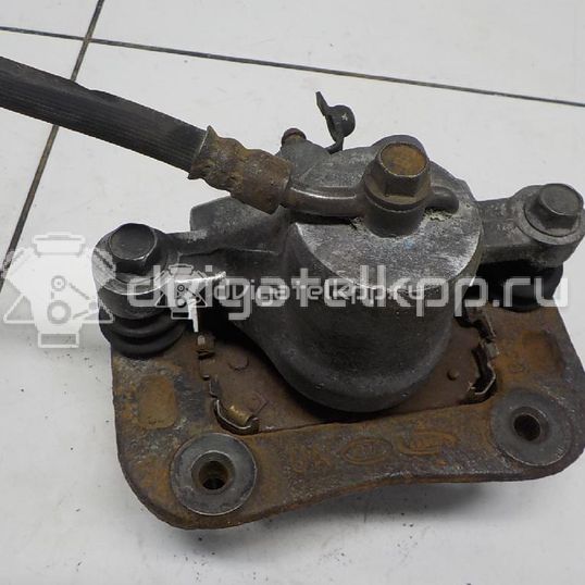 Фото Суппорт тормозной задний правый  582301D100 для Kia Carens