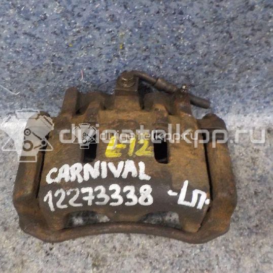 Фото Суппорт тормозной передний левый  0K56A33990B для Kia Carnival
