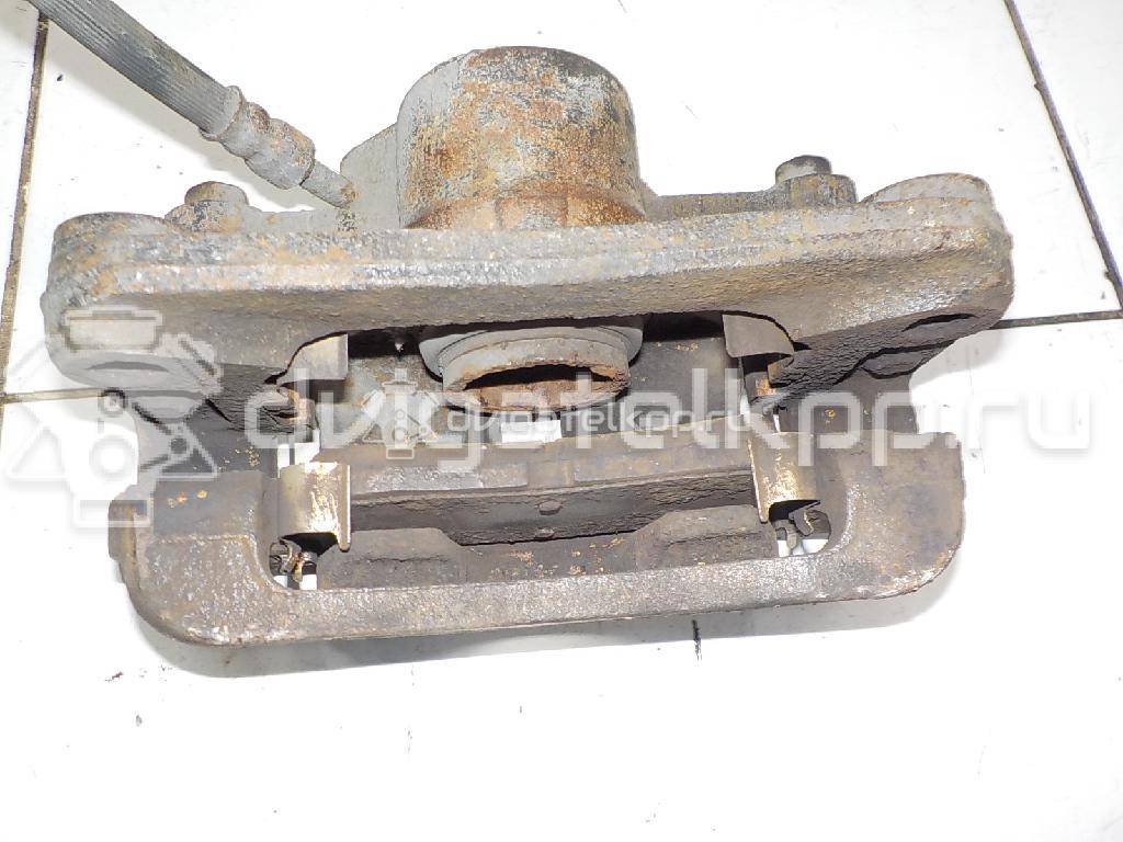 Фото Суппорт тормозной задний правый  582304D200 для Kia Carnival {forloop.counter}}