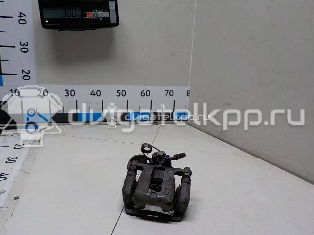 Фото Суппорт тормозной задний левый  583001W350 для Kia Rio {forloop.counter}}