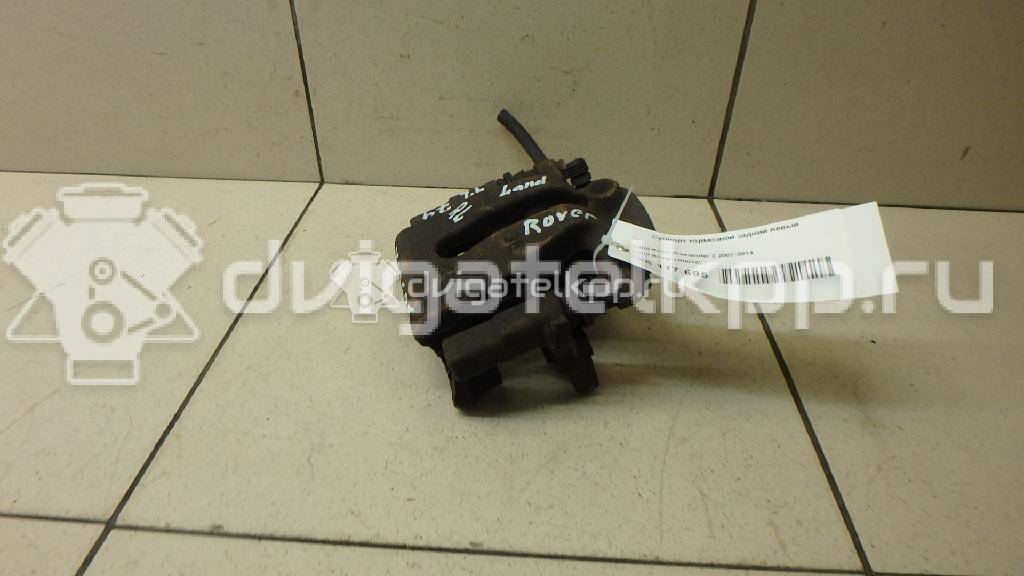 Фото Суппорт тормозной задний левый  LR001027 для Land Rover Freelander {forloop.counter}}